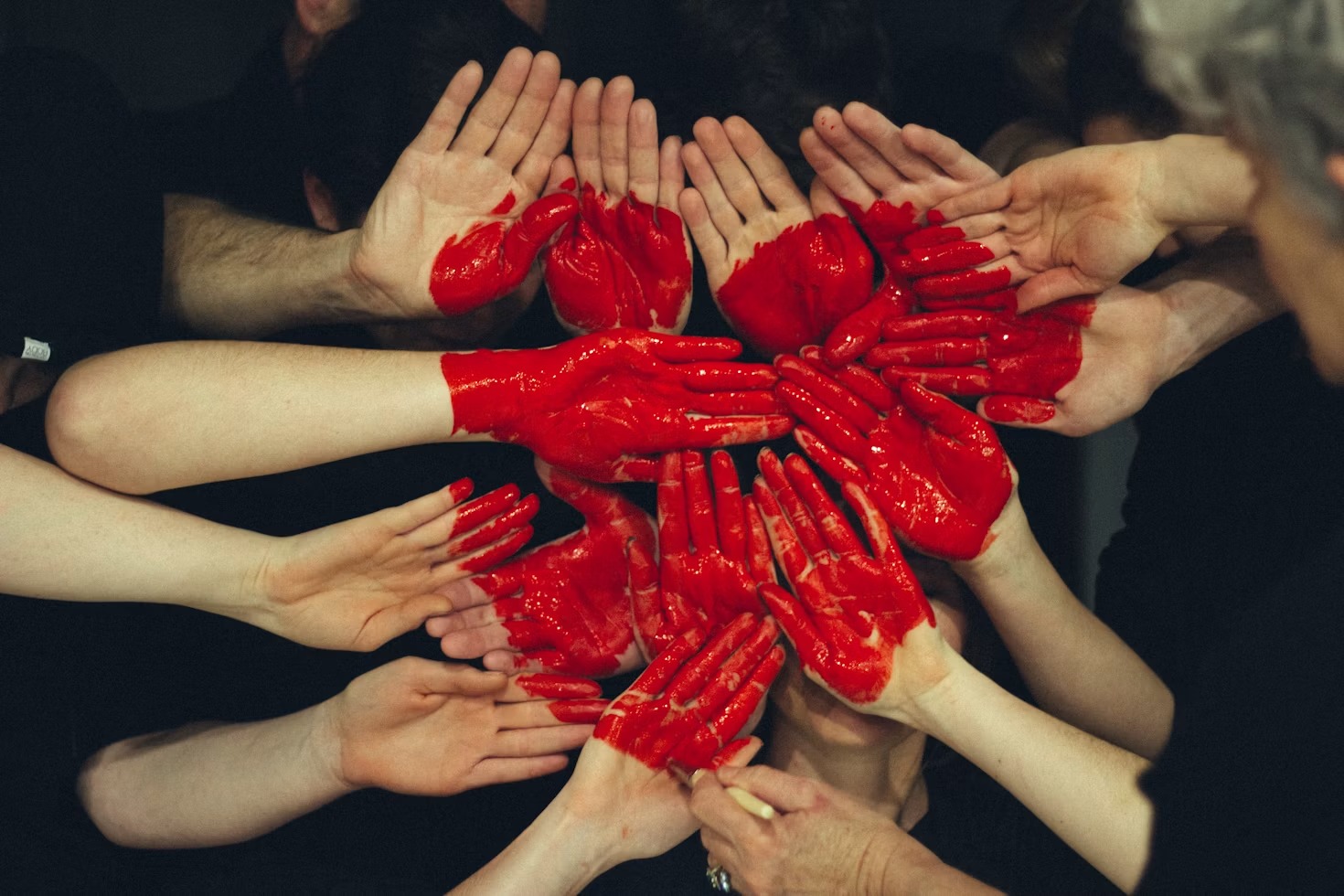 Community members joining hands together